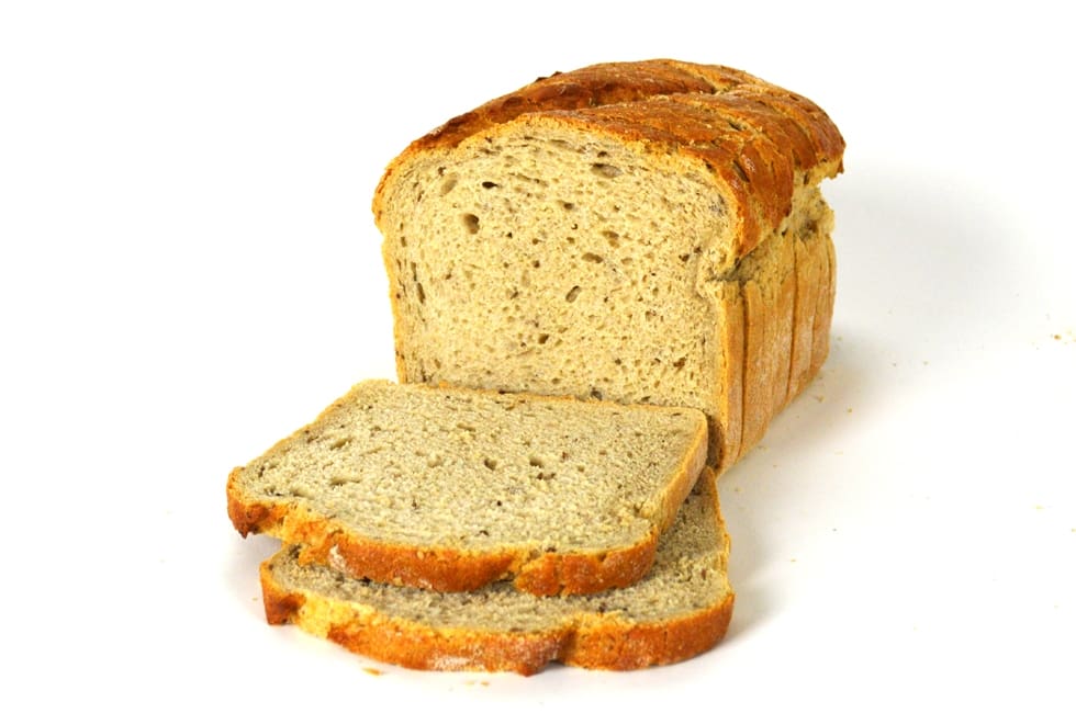 Sliced bread with crust on table